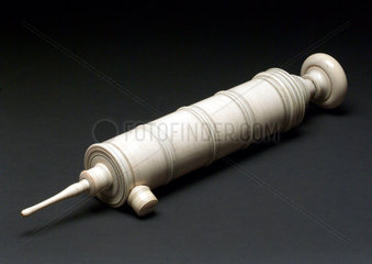 Large ivory enema syringe with piston action  French  18th century.