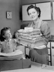 Mother and daughter with the laundry  1950.