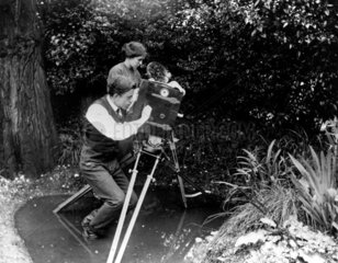 F Percy Smith  English filmmaking pioneer  filming in a pond  c 1910.