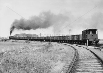 Train of iron ore tippler wagons and 20-ton standard brake.