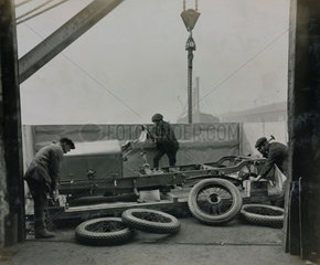 Napier car engine and chassis preparing for shipping at the docks