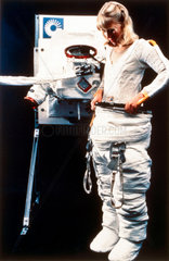 Donning a Space Shuttle spacesuit  1983.