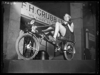 Woman on a horizontal bicycle  1933.