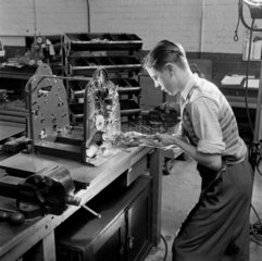 A young apprentice assembles a Gestetner machines  1954.