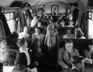Pupils seated in the carriage  en route for