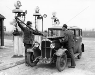 Motor car at a petrol station  25 April 193
