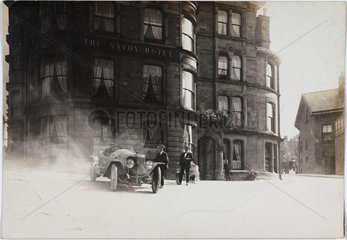 Motor car outside a hotel  c 1912.