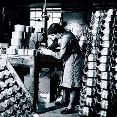 Working at a utensil factory  Warwickshire  6 April 1945.