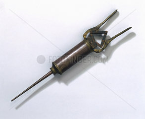 Brass enema syringe  possibly Portugese  18th century.
