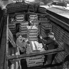 Transferring aluminium ingots to boats  Grand Union Canal  Brentford  1950.