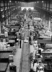 Road wagons being loaded in goods depot  c 1950s?