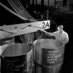 A Terylene production worker threads looms  ICI Bilingham   1955.