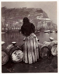 Woman and barrels  Whitby Harbour  c 1905.