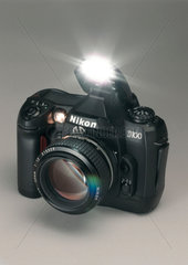 Nikon D100 digital SLR camera with flash attachment  2002.
