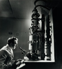 A scientist at electron microscope  research labs  British Titan  1967.