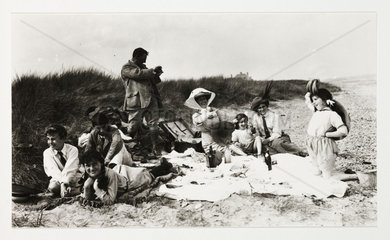 Picnic on the beach  c 1895.