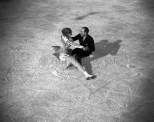 Couple ice-skating  c 1930s.