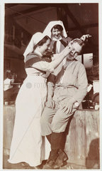 Nurse shaving a soldier  c 1918.