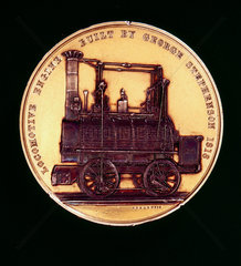 Commemorative medal depicting a locomotive built by George Stephenson.