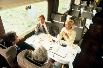 Business people travelling by train  c 1980s.