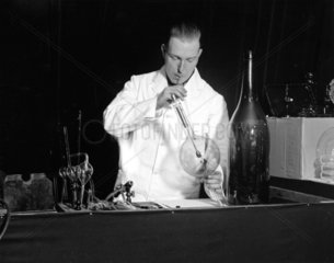 Man blowing glass tubes at the Selfridges