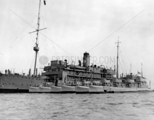 HMS 'Titania' and submarines in dock at Por