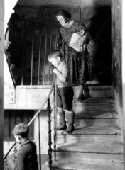 A family on the stairway of their tenement