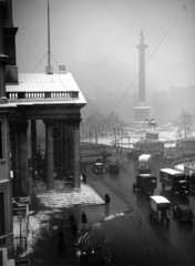 An icey view of Trafalgar Square with St M