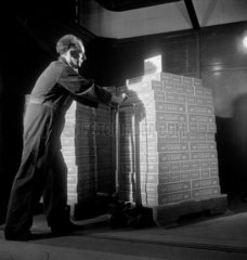Moving boxes of Craven “A � cigarettes  London  1950.