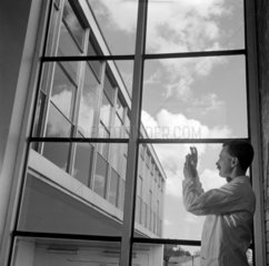 Chemist against window  CIBA pharmaceuticals  Horsham  1960.