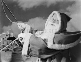 Father Christmas in a sleigh  1950.