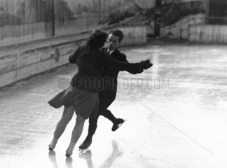 Couple ice-skating  c 1930s.