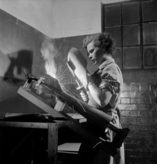 Female welder making bomb fins  Leeds  1953.