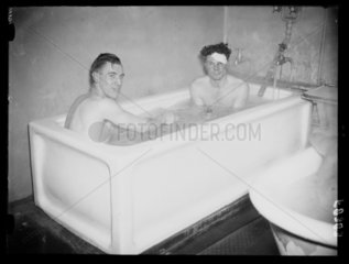 Two footballers share a bath  1938.