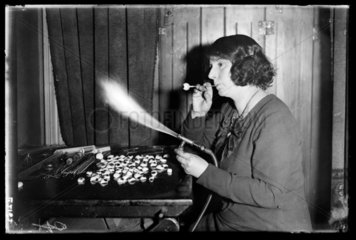 Woman making glass eyes  1935.