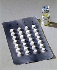 Prototype male pills and bottle of testosterone solution  2001.