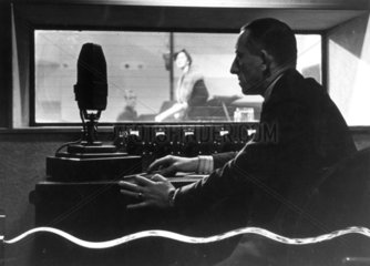Listening to an audition in Broadcasting House  London  10 March 1936.