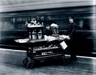 Attendants with a refreshments trolley  Paddington Station  London  1915.