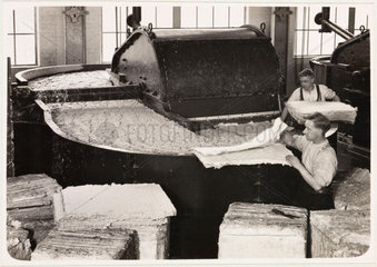 Beater filling (men adding pulp)  1936.