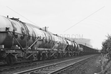 Train of Esso tank wagons and mixed freight.
