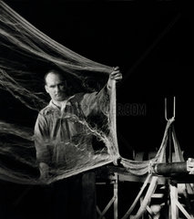 A process worker at ICI Ardil Technical department Inspects Ardil fibre  1956.