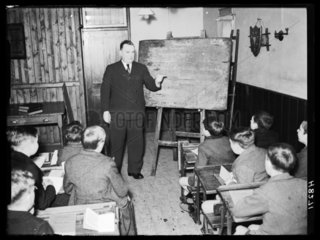 Headteacher in a classroom  29 December 1939.