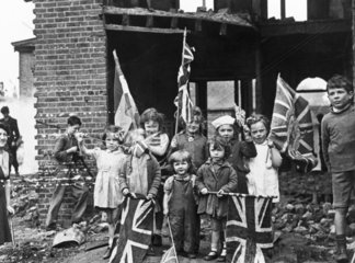 Children waving flags on VE Day  8 May 1945