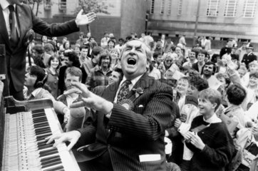 Dennis Healey playing the piano at Huddersfield Town Hall  May 1987.