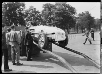 Prince Lobkowicz's Bugatti being unloaded from a truck  Berlin  1932.