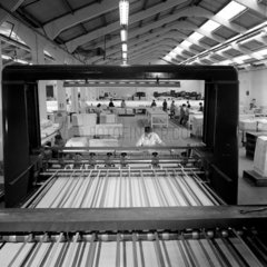 Interior of paper finishing plant with the cutting machine in foreground  1967.