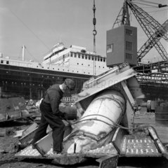 An acetylene welder breaks up sections of the Liner SS Britannic for scrap  1961
