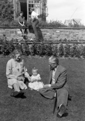 Family group in a garden  c 1948.