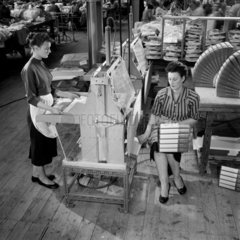 Two women making shirt boxes  at Tern Plastics  Tottenham  1958.
