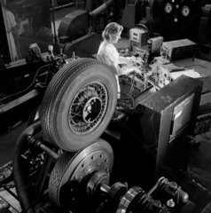 A female worker makes brake tests on Jaguar car at Ferodo  1954.